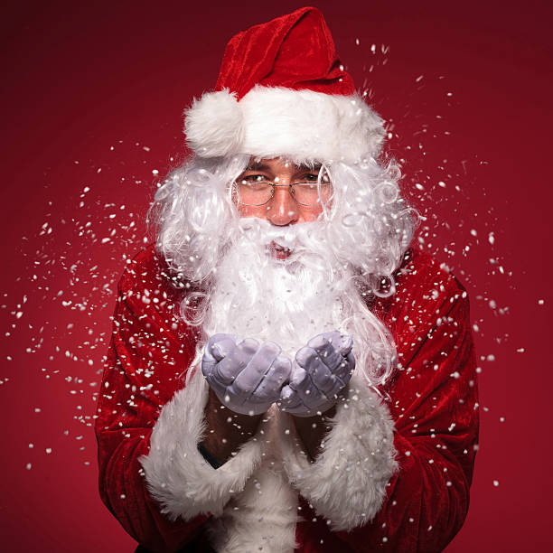 istock Santa Claus with glasses  blowing snow 456053179
