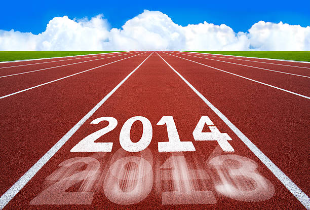 istock New Year 2014 on running track concept with blue sky. 456057515