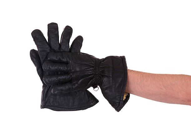 istock Mans hand in very old black leather glove 456057919