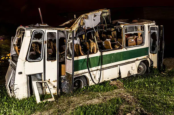 bus destroyed and abandoned at night