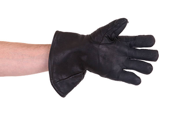 istock Mans hand in very old black leather glove 456060293