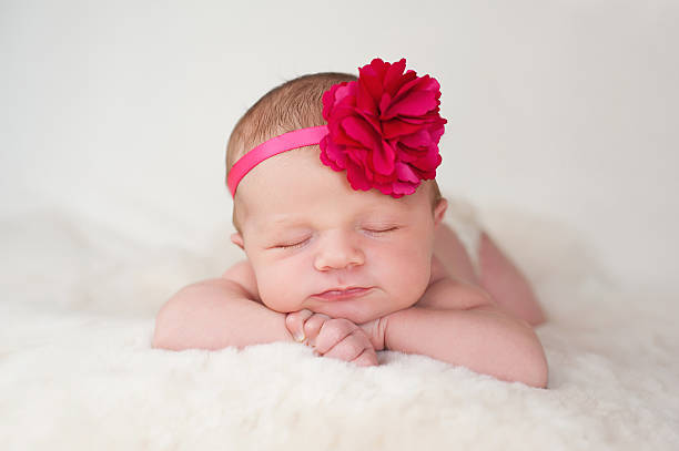 Newborn Baby Girl with Hot Pink Flower Headband stock photo