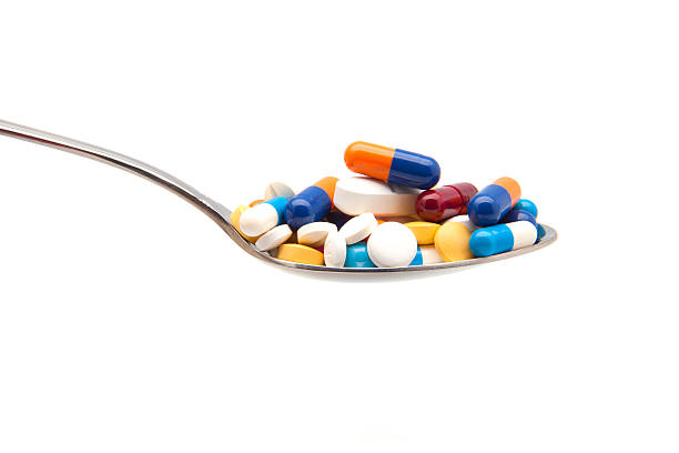 colorido pastillas - capsule vitamin pill red lecithin fotografías e imágenes de stock