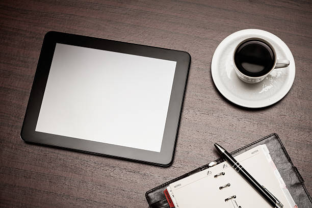 istock empty tablet and a cup of coffee in office 456064965