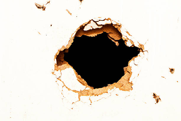 istock Hole in the fibreboard 456066643