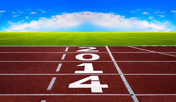 New Year 2014 on running track concept with blue sky.