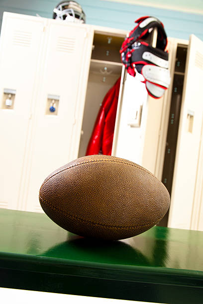 istock Sports: Football on bench in locker room. 456069199