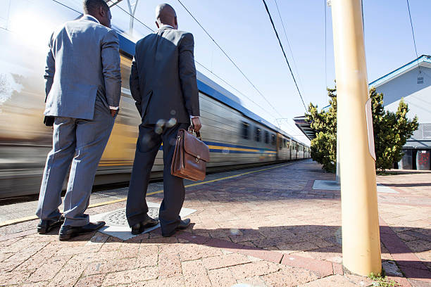 istock Two african businessman waiting for the train to stop. 456072341