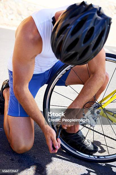 Making Sure His Bicycle Is Ready To Ride Stock Photo - Download Image Now - Active Lifestyle, Activity, Adult