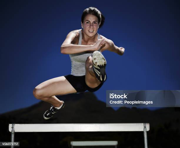 Feeling Like A Fitness Warrior Stock Photo - Download Image Now - Athlete, Hurdle, Jumping