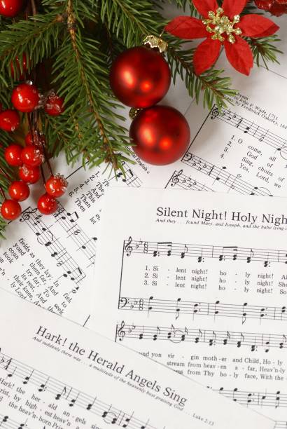 istock Christmas carol music sheets and ornaments 456075237