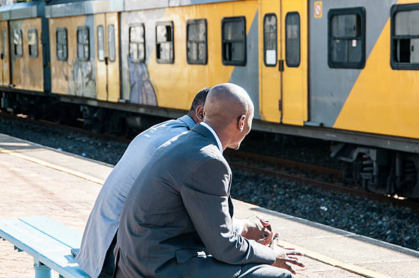 istock African businessmen having a conversation while waiting for their train. 456081189