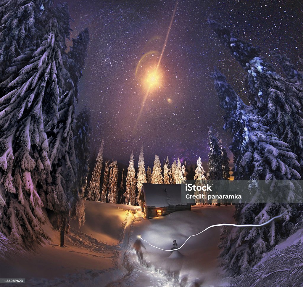Residence Santa Claus Traveling through the winter mountains, bold and romantic people can find shelter in the hunting huts, Glued to the panorama at a slow. The Milky Way as smoke rises over the frozen nature... Moon Stock Photo