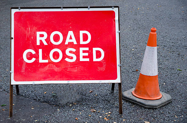 Road closed sign Road closed sign with traffic cone traffic cone photos stock pictures, royalty-free photos & images