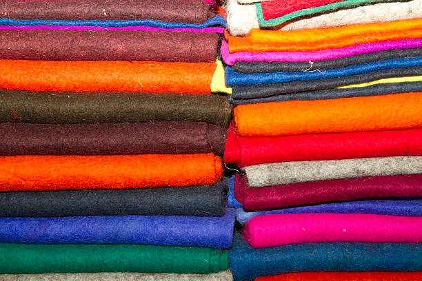 istock Rolled up colorful satin in a fabric shop 456095905