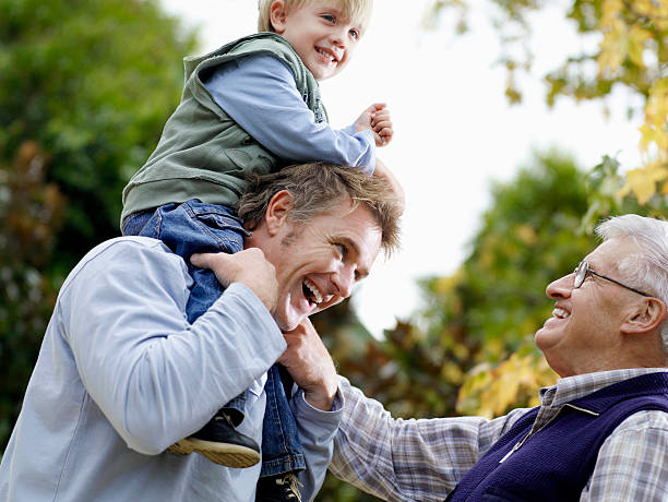 istock Boy With Father And Grandfather Enjoying In Park 456095991