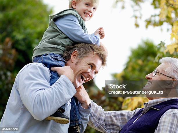 Boy With Father And Grandfather Enjoying In Park Stock Photo - Download Image Now - Australia, Father, Child