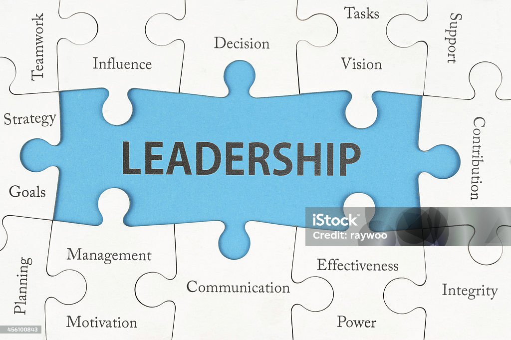 Leadership concept Leadership concept with group of jigsaw puzzle pieces Aspirations Stock Photo