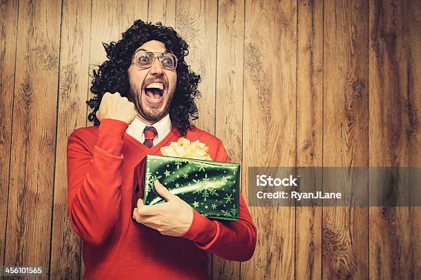 Christmas Perm Guy Celebrates A Gift Stock Photo - Download Image Now - Christmas, Humor, Bizarre