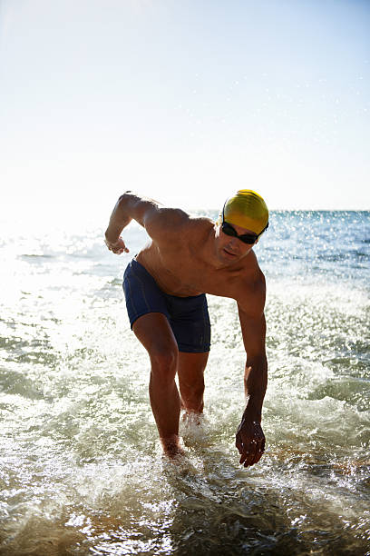 istock Emerging from the water a fitter man 456105841