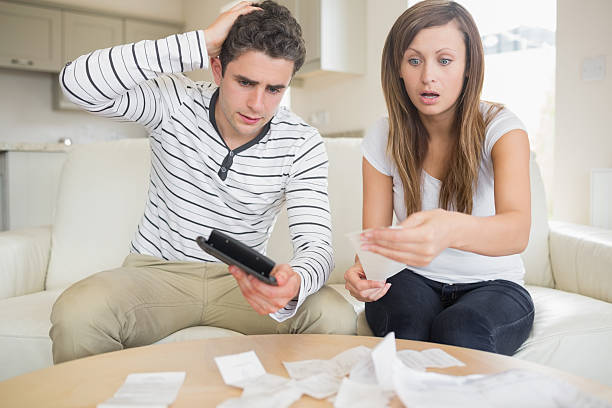 istock Woman getting shocked by the bills 456106273