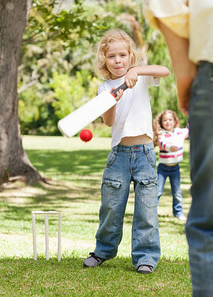 istock Boy hits a ball with cricket bat 456106357