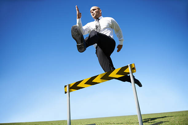 istock Jumping over business hurdles 456107879