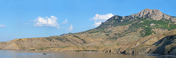 Panorama of Lisya bay and Echki Dag Mountain in Crimea Panorama of Lisya bay with tent camp and Echki Dag Mountain in the morning, Crimea, Ukraine lisya bay stock pictures, royalty-free photos & images