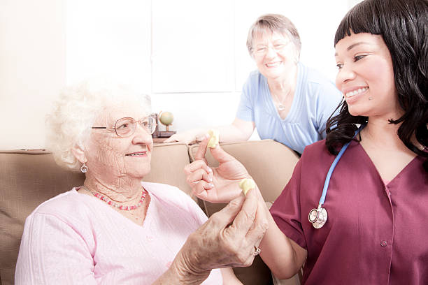 istock Healthcare: Senior woman does finger therapy with putty. 456108253