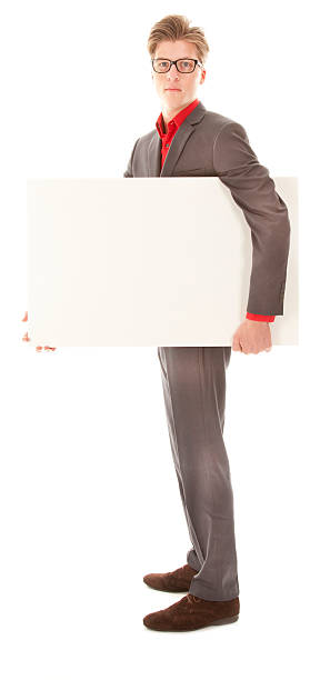 istock Young man holding a white board isolated 456109651