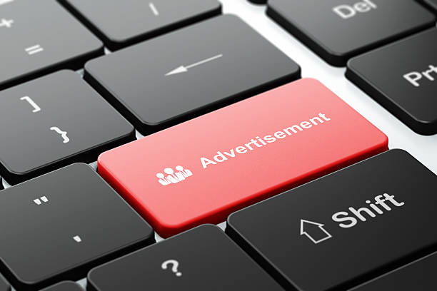 istock Advertising concept: Business People and Advertisement on computer keyboard background 456110771