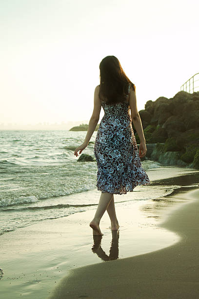 istock Woman on the beach 456111941