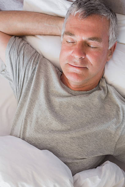 istock Mature man sleeping in his bed 456117691