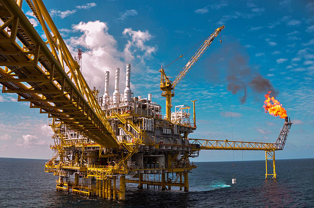 istock Oil and gas platform with burning 456125979