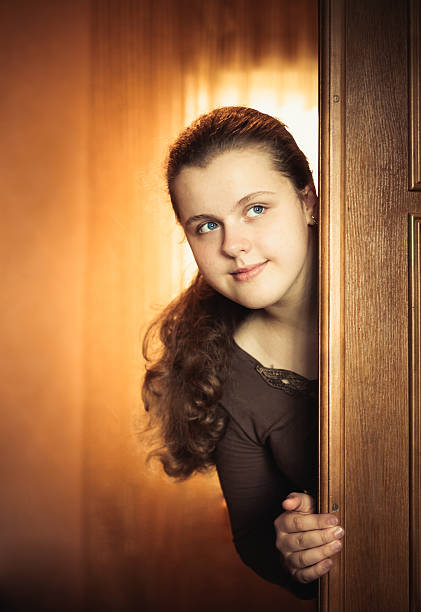 istock Girl Opening Door 456155279