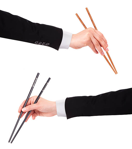 istock Businessman's hand Holding Chopsticks 456240651