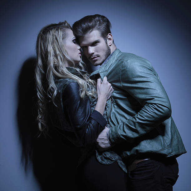 istock fashion couple in leather jackets pulling each other closer 456241029