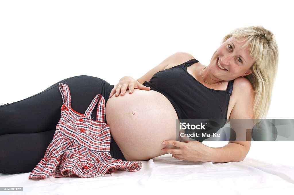 Pregnancy pregnant woman with baby clothes 6-11 Months Stock Photo