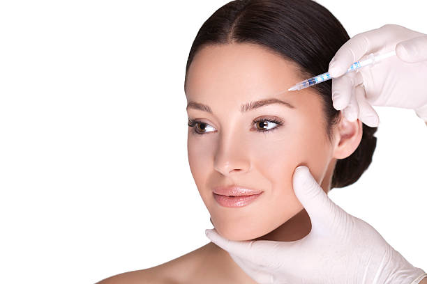 iniezione di botox cosmetici - plastic beauty injecting protective glove foto e immagini stock