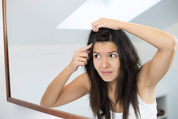 istock Horrified young woman looking in the mirror 456253655