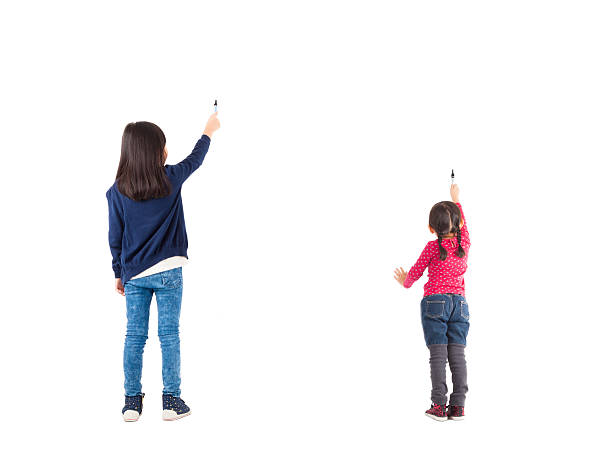 istock rear view two kids drawing isolated on white 456280179
