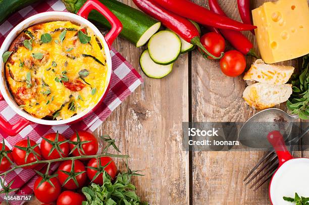 Vegetable Casserole In A Red Pot Stock Photo - Download Image Now - Backgrounds, Baked, Baking