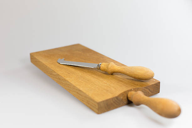 istock Cheese knife and wooden board 456501397