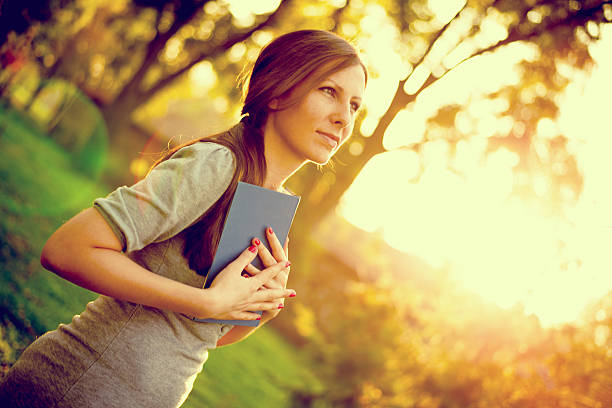 istock girl enjoying a book 456502415