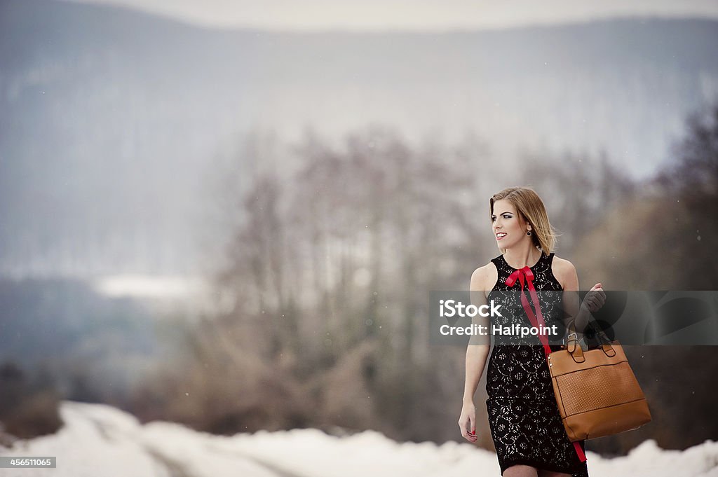 Winter fashion Attractive model wearing fashion dress in winter country Adult Stock Photo