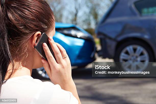 Female Driver Making Phone Call After Traffic Accident Stock Photo - Download Image Now