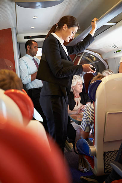 istock Businesswoman Using Mobile Phone On Busy Commuter Train 456512409