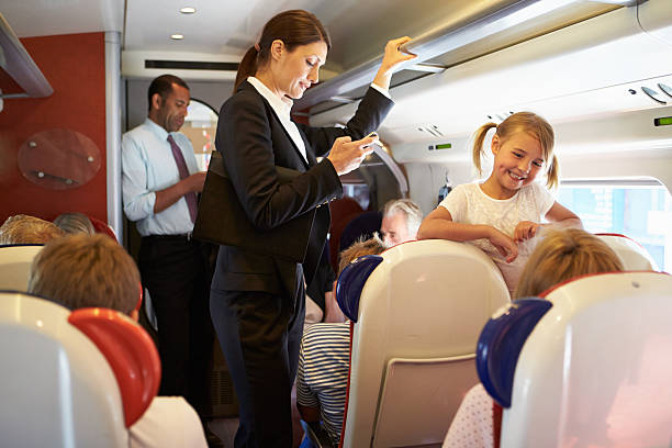 istock Businesswoman Using Mobile Phone On Busy Commuter Train 456512445