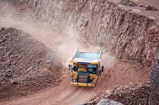 istock dumper truck on road in surface mine quarry 456520293