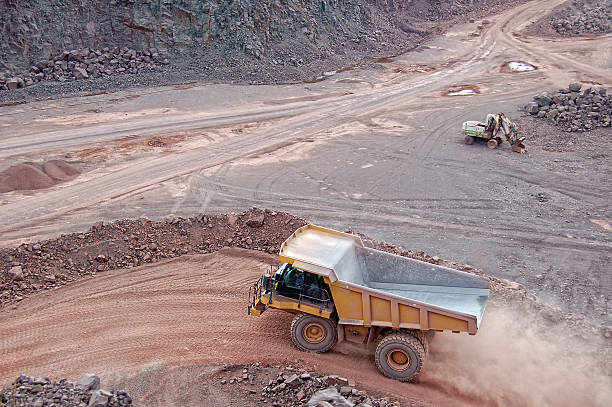 istock dumper truck on road in surface mine quarry 456520477